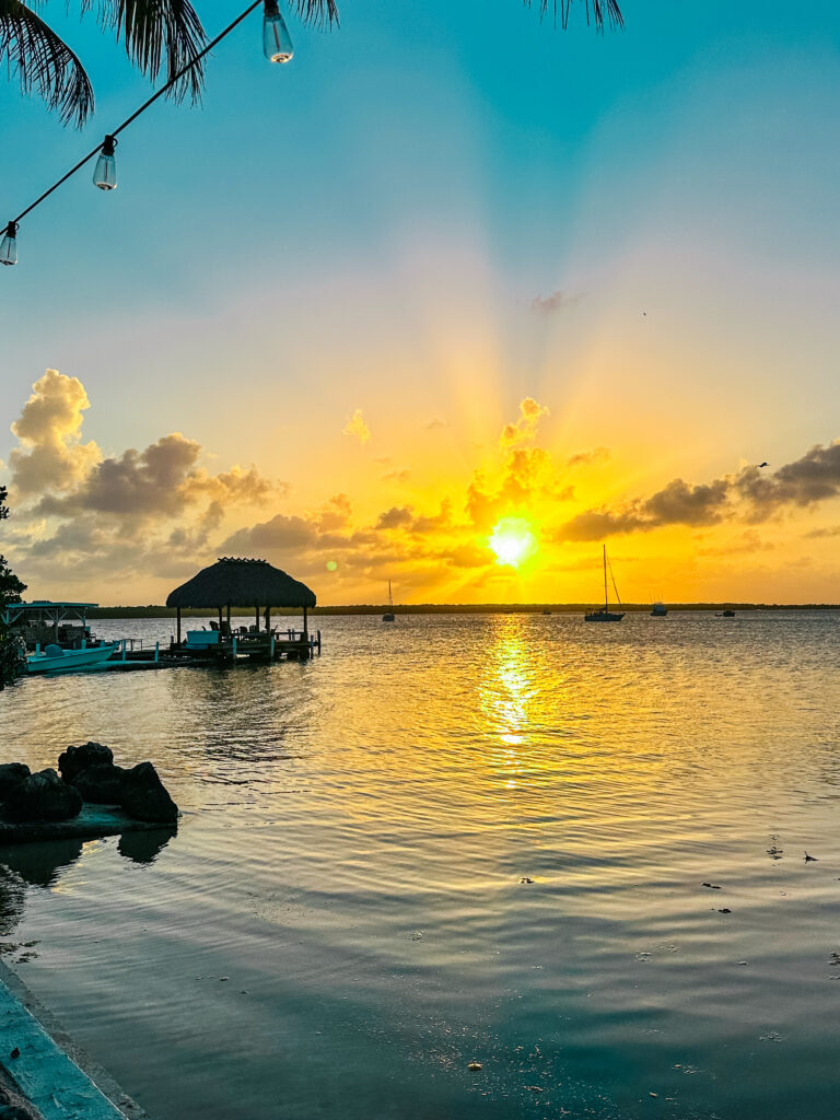 Beautiful sunset view at Florida Bay, Key Largo, with calm waters and sailboats