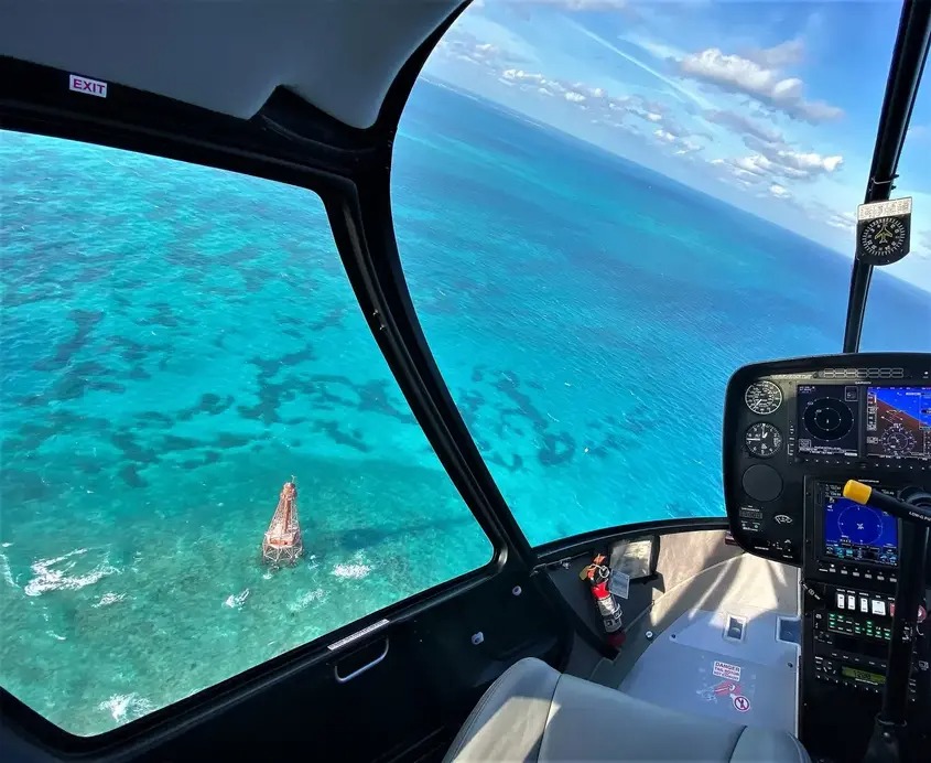 Helicopter cockpit looking over the waters of the Florida Keys