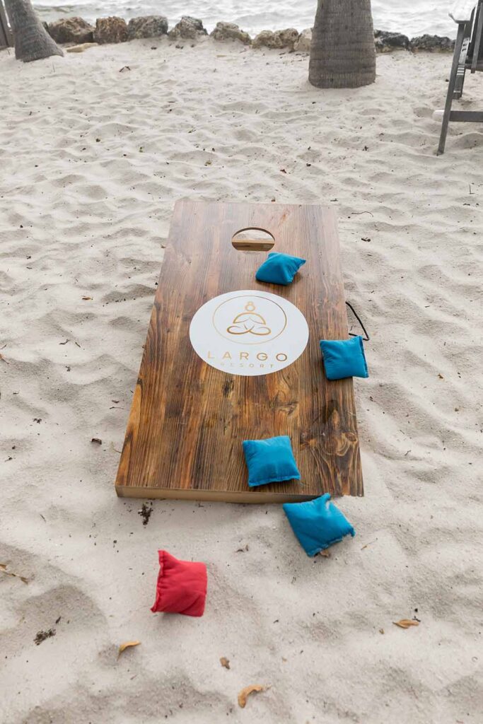Corn hole bean bag game on the beach at Largo Resot