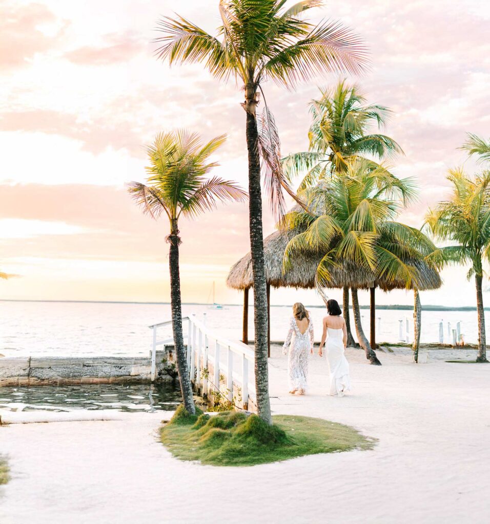 wedding couple walking private dock at sunset during destination wedding at largo resort ley largo florida - photo by Tayla Paige Photo