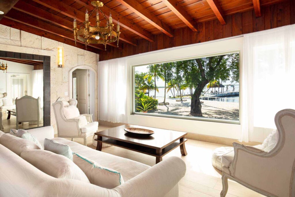 Grand Lodge large living area with comfortable seating and large window with ocean views