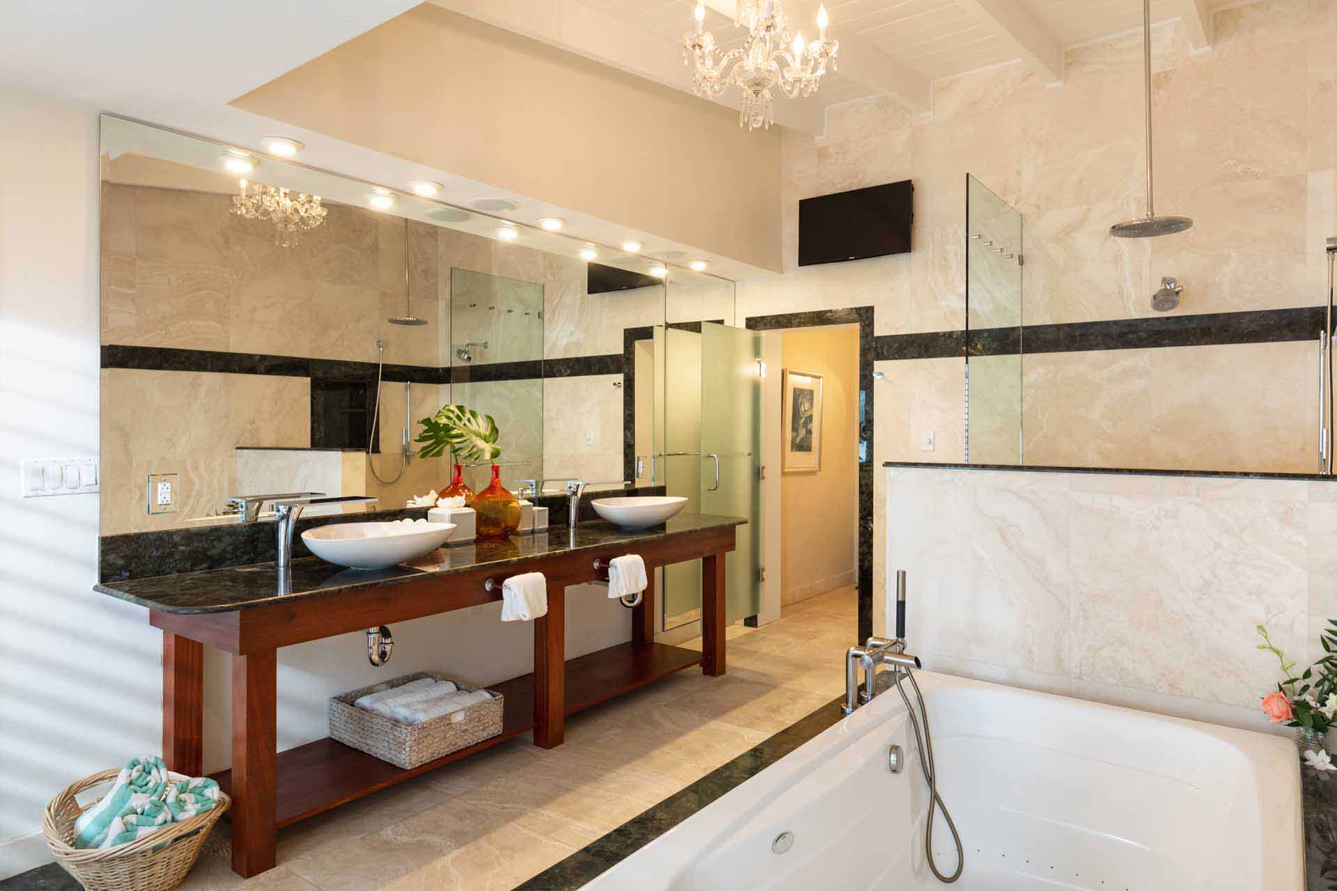 Grand Lodge large bathroom with double vanity, soaker tub, and rain shower