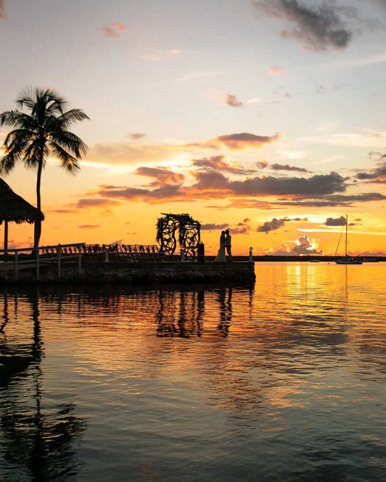 wedding couple during sunset overlooking the ocean in the florida keys at largo resort