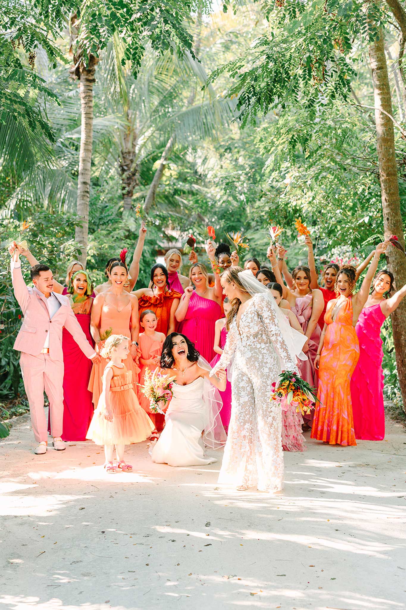destination wedding party at largo resort under tropical beach canopy