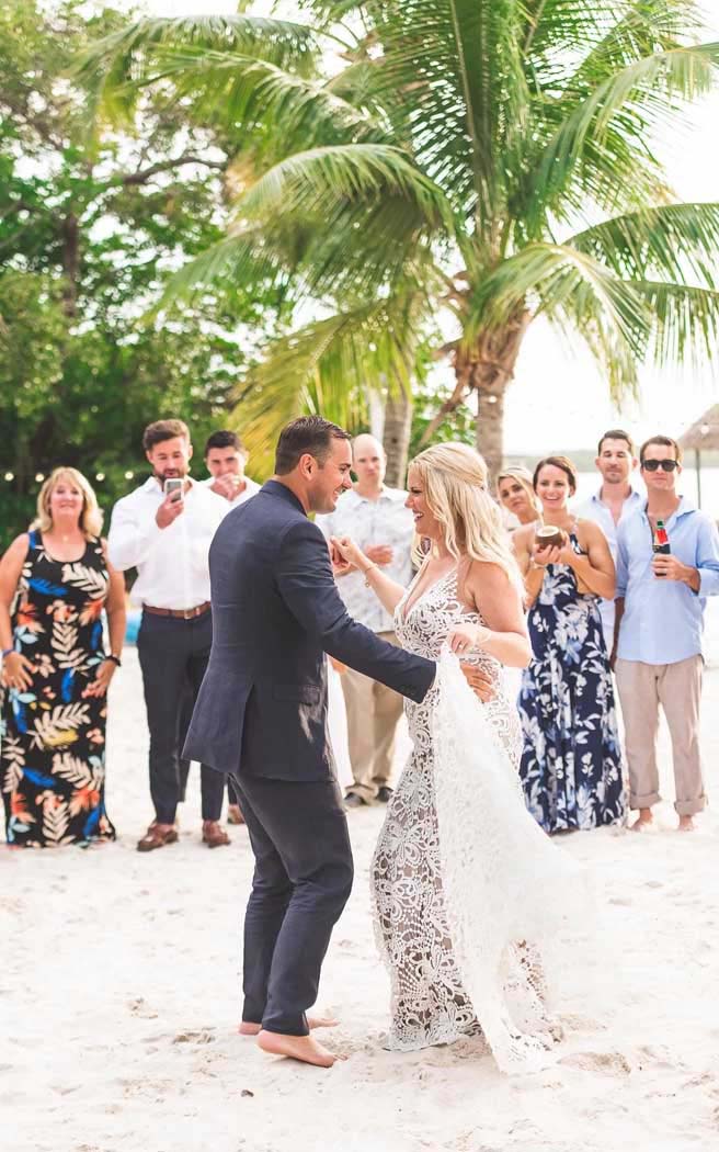 Bride and groom dancing on the beach at Largo Resort