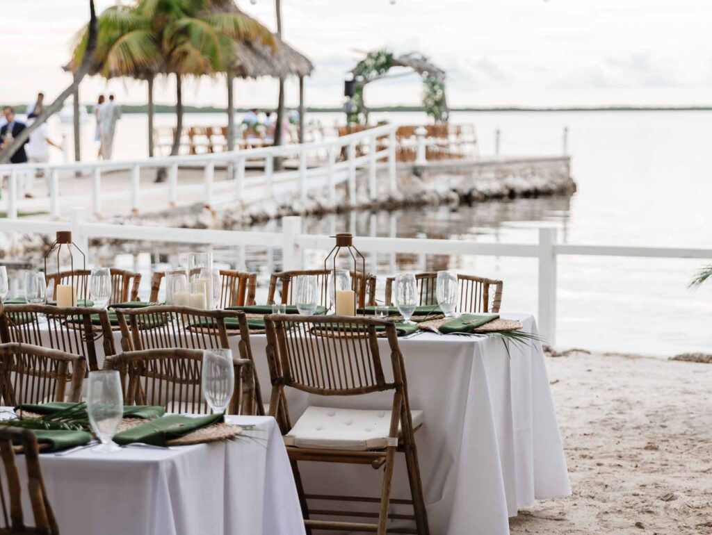 Wedding reception tables set up on the beach at Largo Resort